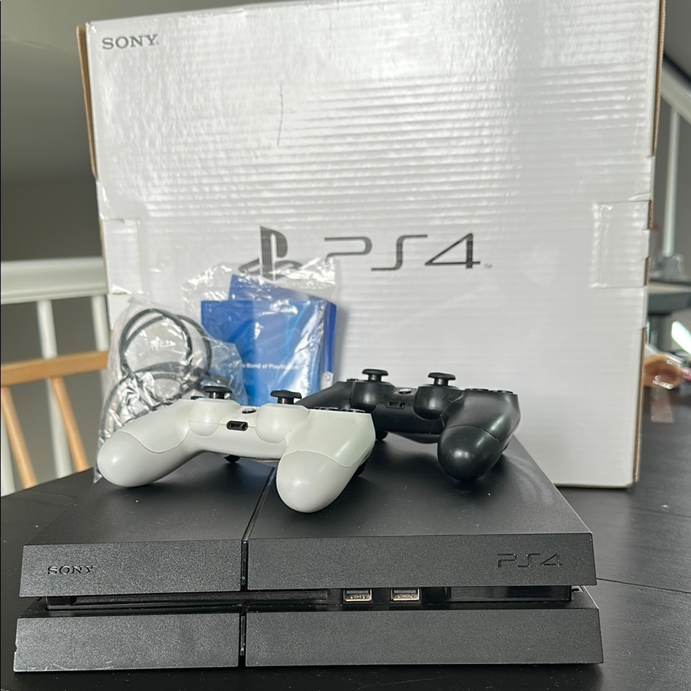 Sony PS4 Console with Black and White Controllers